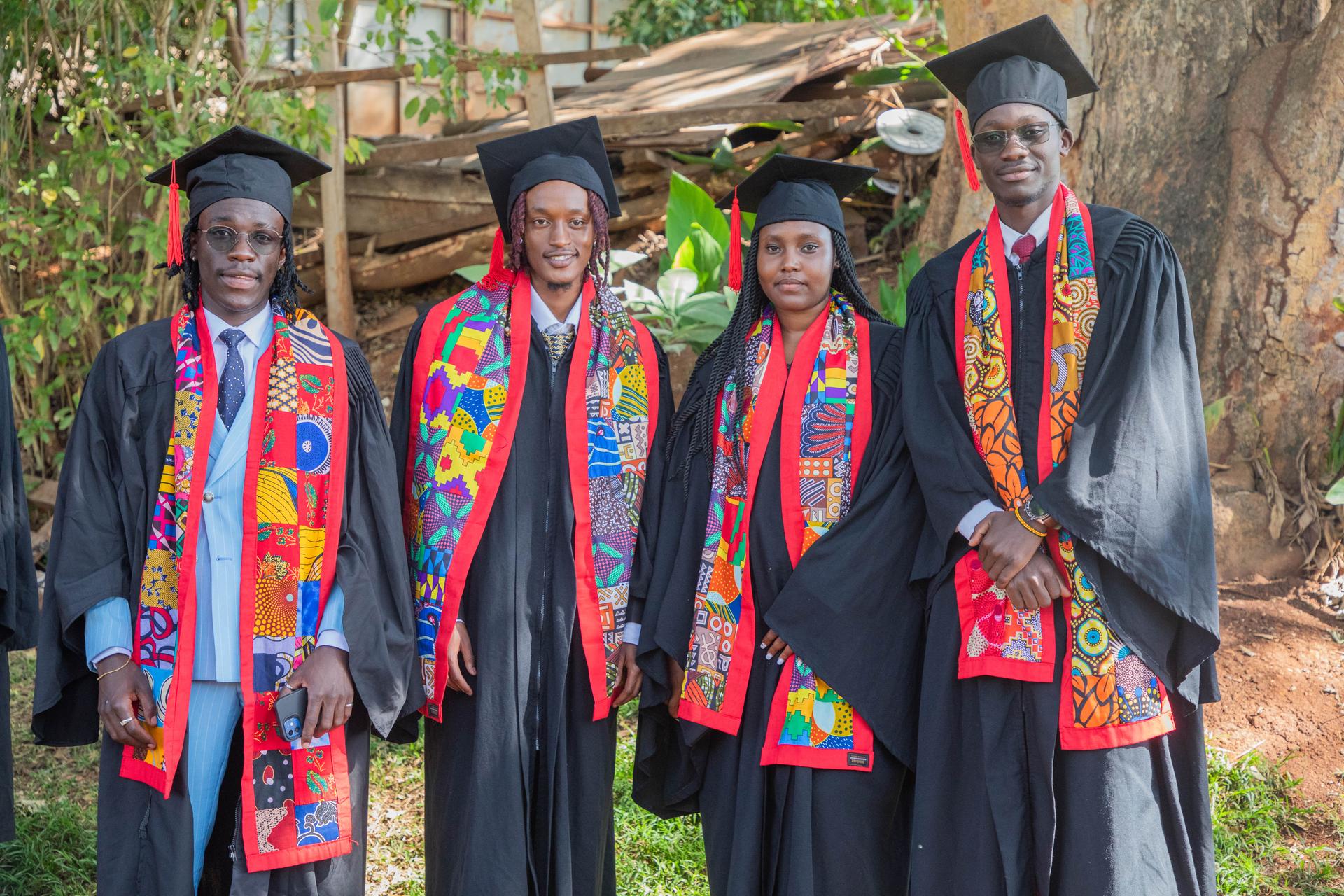 ADMI diploma graduates in caps and gowns with African stoles